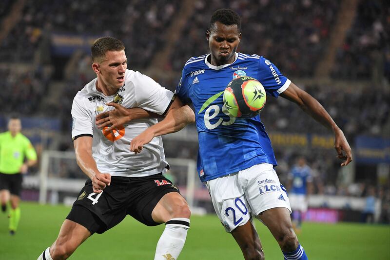 Sven Botman challenges Habib Diallo during the Ligue 1 match between Strasbourg and Lille. AFP