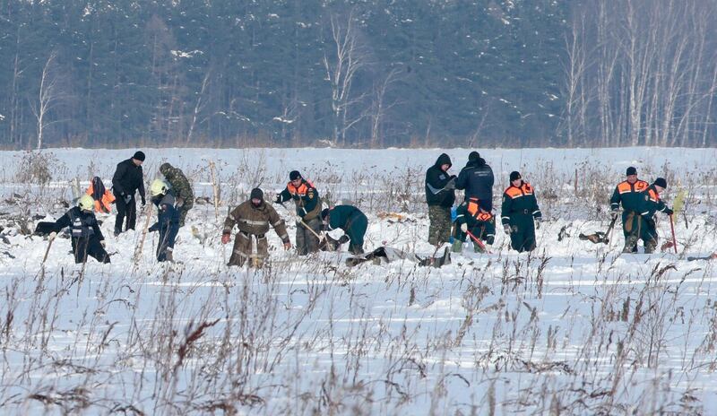 Russian Emergency Situations Ministry members work at the crash site of the short-haul AN-148 airplane operated by Saratov Airlines in Moscow Region, Russia February 12, 2018. REUTERS/Tatyana Makeyeva