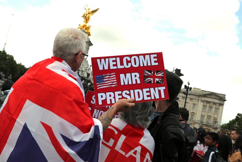 People wait in front of Buckingham Palace during the state visit of U.S. President Donald Trump and First Lady Melania Trump to Britain, in London, Britain, June 3, 2019. Reuters