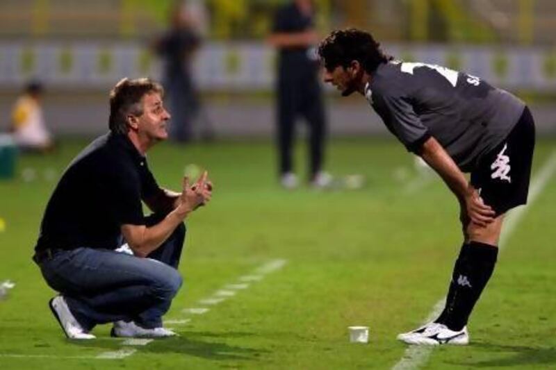 Dubai, United Arab Emirates, October 28, 2012: Al Dhafra's head coach Dzemal Hadziabdic, left, speaks with Saif Mohamed during the seond half of their Pro League match against Al Wasl at Zabeel Stadium in Dubai on October 28, 2012. Christopher Pike / The National