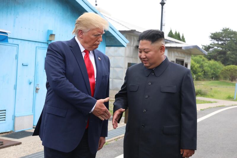 Kim Jong Un and US President Donald Trump inside the demilitarised zone (DMZ) separating the South and North Korea on June 30, 2019 in Panmunjom, South Korea. Getty Images