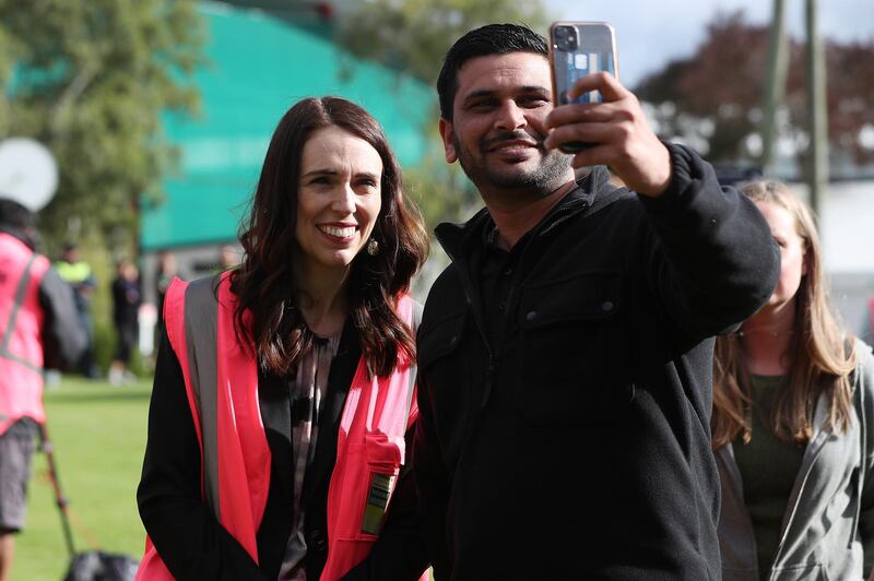Prime Minister Jacinda Ardern (L) has a selfie taken as she meets and talks to staff during the visit to Trevelyans Kiwifruit and Avocado Packhouse in Tauranga, New Zealand. Getty Images