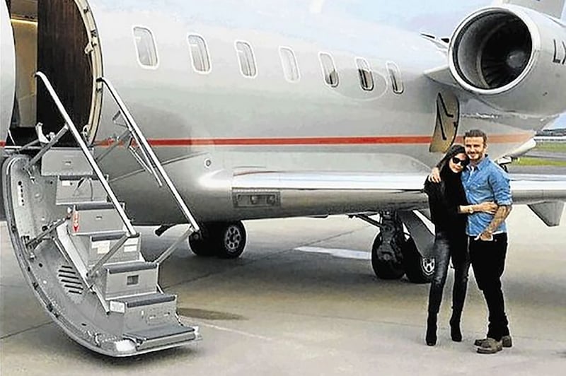 Beckham and wife Victoria pose by their private jet. Photo: Instagram @victoriabeckham 