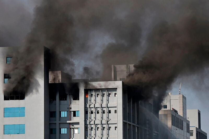 Smoke rises after a fire broke out at India's Serum Institute in Pune. AFP