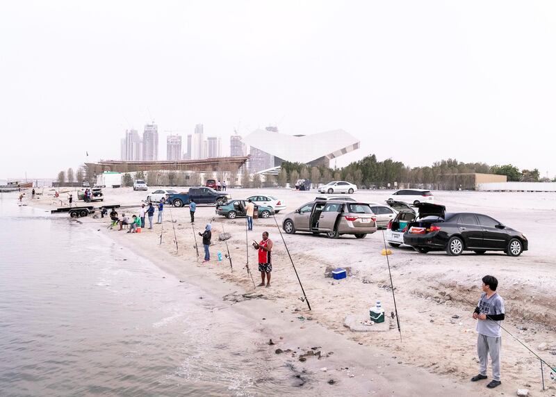 DUBAI, UNITED ARAB EMIRATES. 28 JULY 2020. 
People fishing by Business Bay Bridge.
(Photo: Reem Mohammed/The National)

Reporter:
Section: