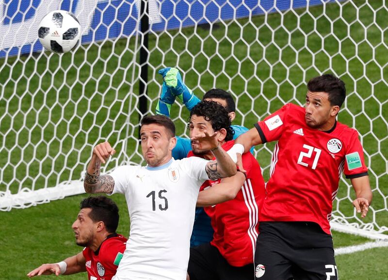 Uruguay's Matias Vecino, second left, and Egypt's Trezeguet, right, during their group A match at the 2018 FIFA World Cup at the Yekaterinburg Arena in Yekaterinburg, Russia, on June 15, 2018. Roman Pilipey / EPA