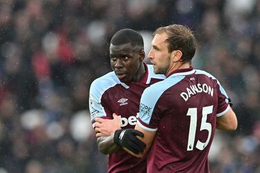 West Ham United's French defender Kurt Zouma (L) and West Ham United's English defender Craig Dawson (R) speak together during the English Premier League football match between West Ham and Newcastle United at the London Stadium, in London on February 19, 2022.  (Photo by JUSTIN TALLIS / AFP) / RESTRICTED TO EDITORIAL USE.  No use with unauthorized audio, video, data, fixture lists, club/league logos or 'live' services.  Online in-match use limited to 120 images.  An additional 40 images may be used in extra time.  No video emulation.  Social media in-match use limited to 120 images.  An additional 40 images may be used in extra time.  No use in betting publications, games or single club/league/player publications.   /  