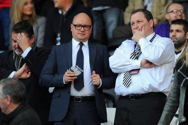 FILE: Premier League club Newcastle United have been put up for sale by owner Mike Ashley SWANSEA, WALES - OCTOBER 04: Newcastle United owner Mike Ashley (r) chats with managing director Lee Charnley before the Barclays Premier League match between Swansea City and Newcastle United at Liberty Stadium on October 4, 2014 in Swansea, Wales. (Photo by Stu Forster/Getty Images)