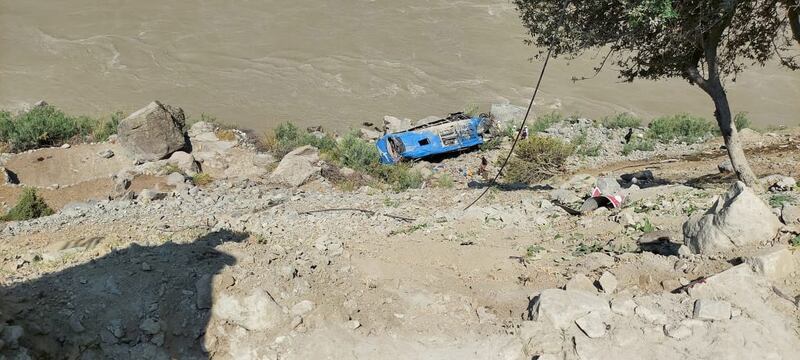 The wreckage of the bus lies at the bottom of a ravine following the blast in Pakistan.
