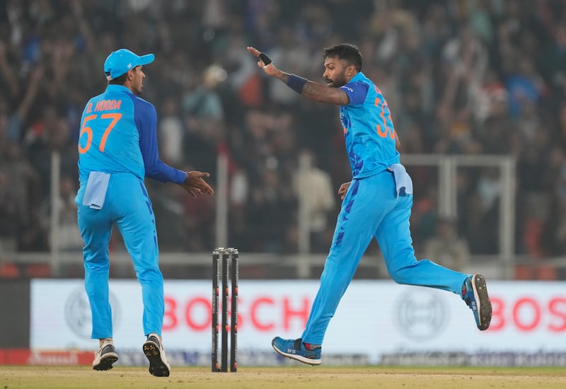 India's captain Hardik Pandya celebrates taking the wicket of New Zealand's Glenn Phillips. AP