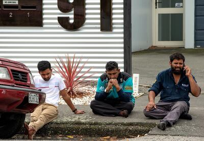 epa07438175 Grieving members of the public sit on a curb following a shooting resulting in multiple fatalies and injuries at the Masjid Al Noor on Deans Avenue in Christchurch, New Zealand, 15 March 2019. According to media reports on 15 March 2019, a gunman opened fire at around 1:40 pm local time after walking into the mosque, killing at least six people. Armed police officers were deployed to the scene, along with emergency service personnel.  Local authorities have advised residents to stay indoors as the situation is evolving. Four people are in custody in connection with the shooting, and other possible perpetrators are reportedly still at large. There have been confirmed reports of a shooting at a second mosque in Christchurch.  EPA/Martin Hunter NEW ZEALAND OUT