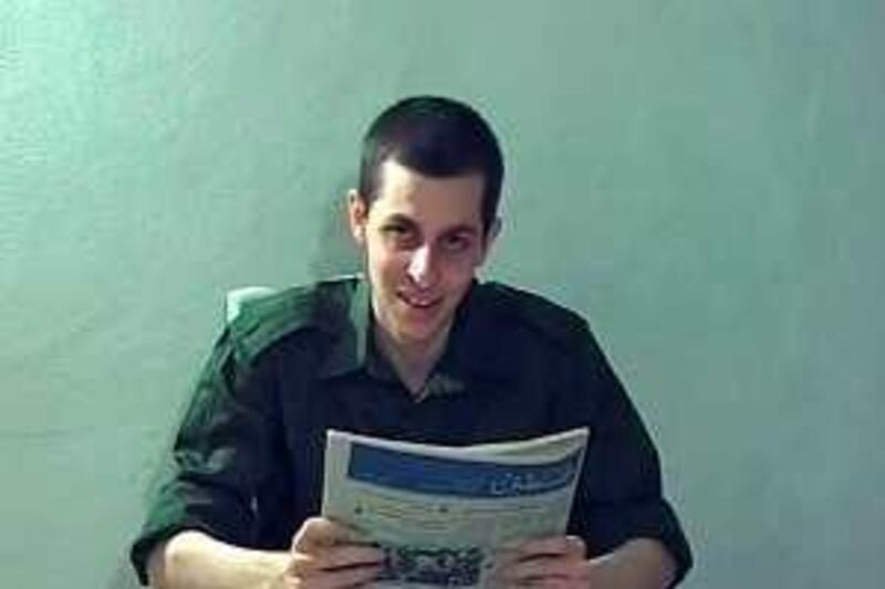 Captured Israeli soldier Gilad Shalit is seen in this video grab released October 2, 2009 by Israeli television. A two-minute video of the Israeli soldier held captive by the Palestinian Islamist group Hamas for the past three years shows him "healthy and coherent" and speaking to the camera, Israeli officials said on Friday.
 REUTERS/Handout (POLITICS CONFLICT IMAGES OF THE DAY) FOR EDITORIAL USE ONLY. NOT FOR SALE FOR MARKETING OR ADVERTISING CAMPAIGNS *** Local Caption ***  JER214_PALESTINIANS_1002_11.JPG