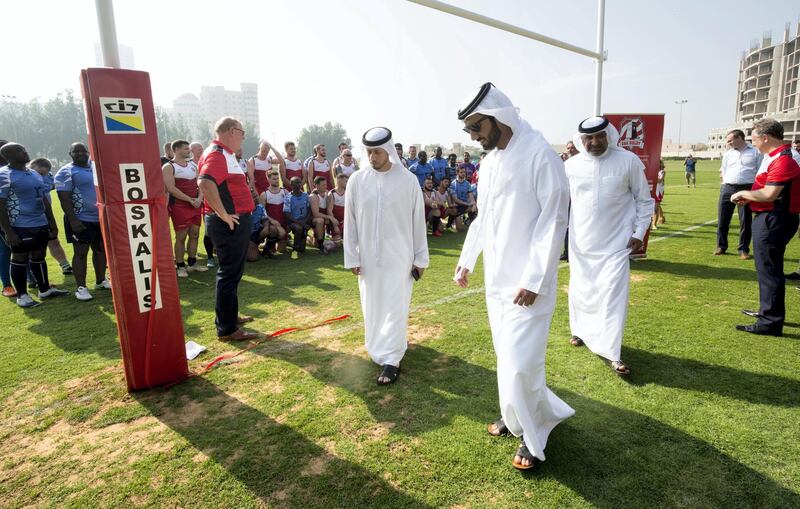 Emirati officials join the teams for the first game and inspect the pitch - which is shared with a golf club