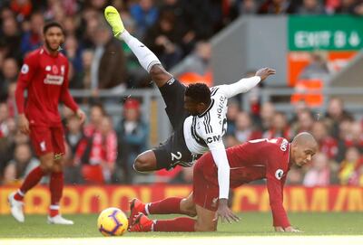 Soccer Football - Premier League - Liverpool v Fulham - Anfield, Liverpool, Britain - November 11, 2018  Fulham's Andre-Frank Zambo Anguissa in action with Liverpool's Fabinho                  Action Images via Reuters/Andrew Boyers  EDITORIAL USE ONLY. No use with unauthorized audio, video, data, fixture lists, club/league logos or "live" services. Online in-match use limited to 75 images, no video emulation. No use in betting, games or single club/league/player publications.  Please contact your account representative for further details.