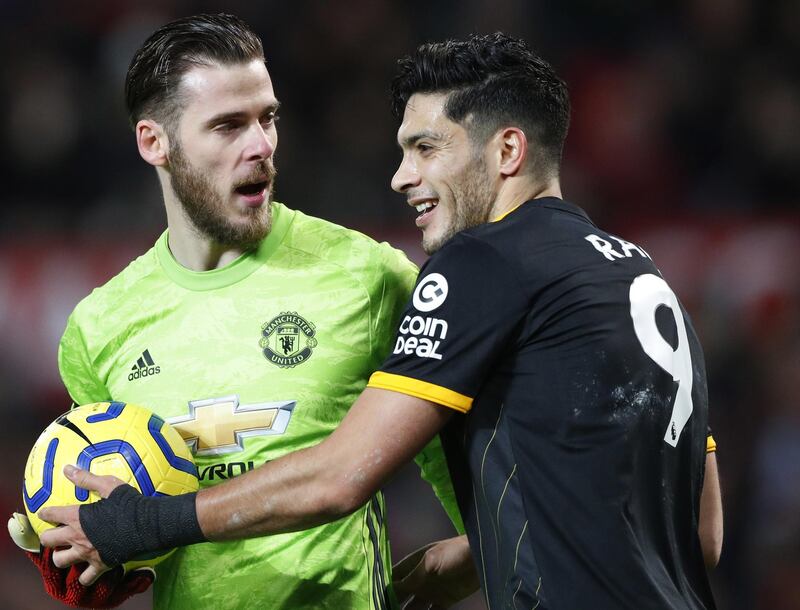 Wolves' Raul Jimenez, right, attempts to retrieve the ball from Manchester United goalkeeper David de Gea. EPA