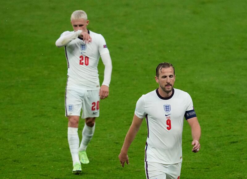 England's Harry Kane and Phil Foden walk off the pitch at half-time. Reuters