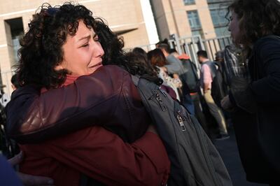 Protesters including lawyers and opposition politicians react after the announcement of the verdict against Osman Kavala, at the Istanbul courthouse. AFP