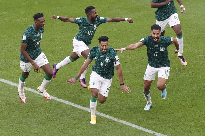 Salem Al Dawsari of Saudi Arabia, front, celebrates with teammates after scoring the second goal in their 2-1 against Argentina during the 2022 World Cup at the Lusail Stadium on Tuesday, November 22, 2022. EPA