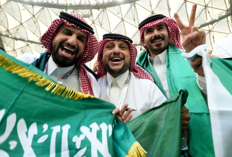 Saudi fans celebrate after their national team beat Argentina 2-1 in the World Cup at the Lusail Stadium in Qatar. PA