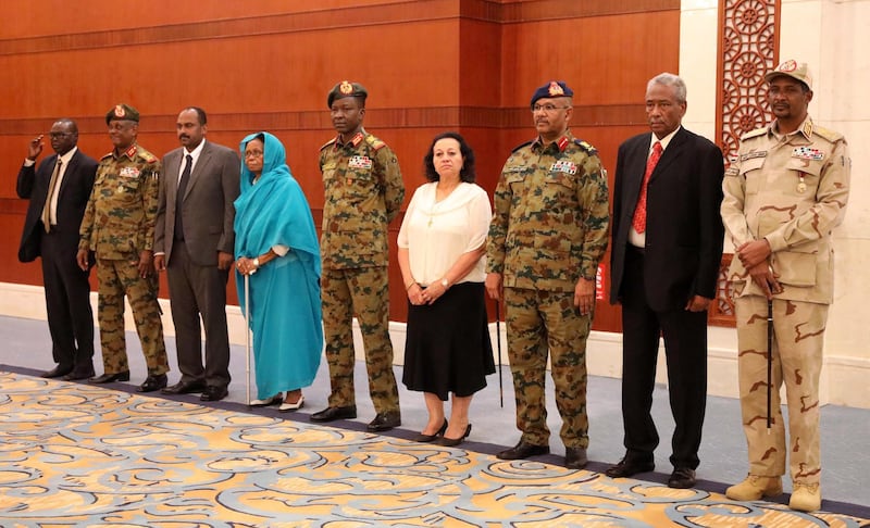 epa07784052 Members of Sudan's newly formed transitional Council (R-L) General Mohamed Hamdan Dagalo, Hassan Sheikh Idris, Genereal Ibrahim Jaber, Raja Nicola Issa Abdul-Masseh, General Shams al-Din Kabashi, Aisha Moussa, Mohamed Alfaki, General Yasser al-Atta and Sadeek Tawer look on during their sweaing-in ceremony at the presidential palace in Khartoum, Sudan, 21 August 2019. The Sudanese opposition and military council signed on 17 August a power sharing agreement. The agreement sets up a sovereign council made of five generals and six civilians, to rule the country until general elections. Protests had erupted in Sudan at the end of 2018, culminating in a long sit-in outside the army headquarters which ended with more than one hundred people being killed and others injured. Sudanese President Omar Hassan al-Bashir stepped down on 11 April 2019.  EPA/MORWAN ALI