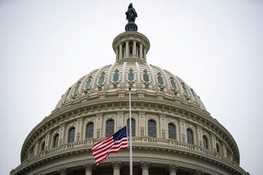 The American flag flies at half staff at the US Capitol Building on the fifth day of the impeachment trial of former President Donald Trump, on charges of inciting the deadly attack on the US Capitol, in Washington, February 13. Reuters