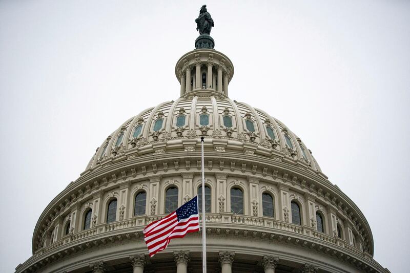 The American flag flies at half staff at the U.S. Capitol Building on the fifth day of the impeachment trial of former U.S. President Donald Trump, on charges of inciting the deadly attack on the U.S. Capitol, in Washington, U.S., February 13, 2021. REUTERS/Al Drago     TPX IMAGES OF THE DAY