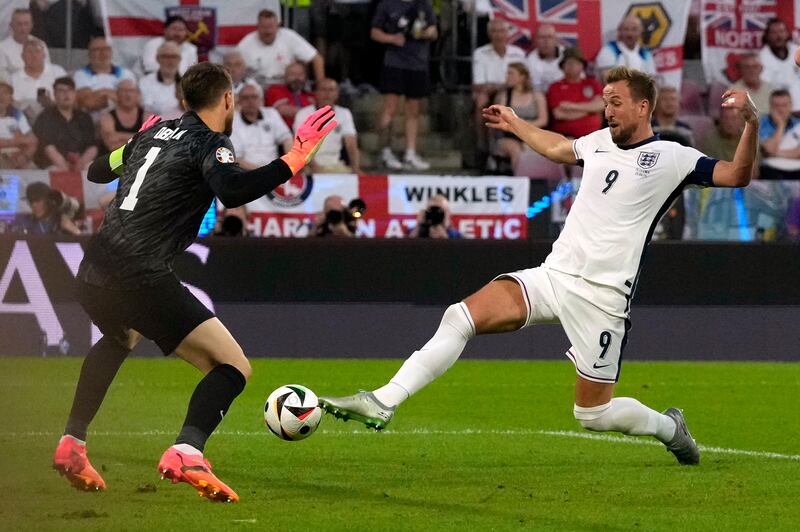 England's Harry Kane just fails to reach  get a touch on a cross from Kieran Trippier as Slovenia's goalkeeper Jan Oblak looks on. AP 