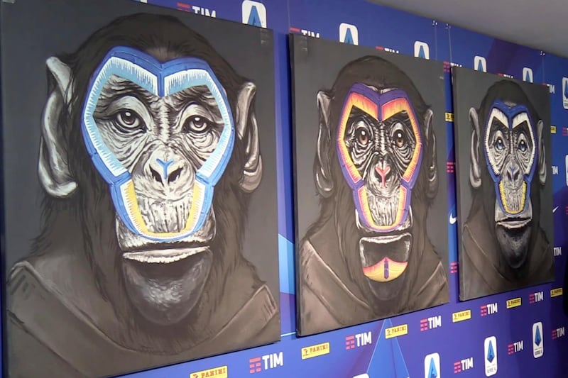 A view of the three paintings, part of a new campaign against racism launched by the Italian soccer league in Milan, Italy, Monday, Dec. 16, 2019. While black players are regularly subjected to monkey chants in games, artist Simone Fugazzotto said his painting featuring three monkeys to represent three different races was meant â€œto show that we are all the same race." The league used the painting at a presentation of its anti-racism campaign in Milan on Monday, stirring up controversy and criticism from both clubs and press. (ANSA via AP)