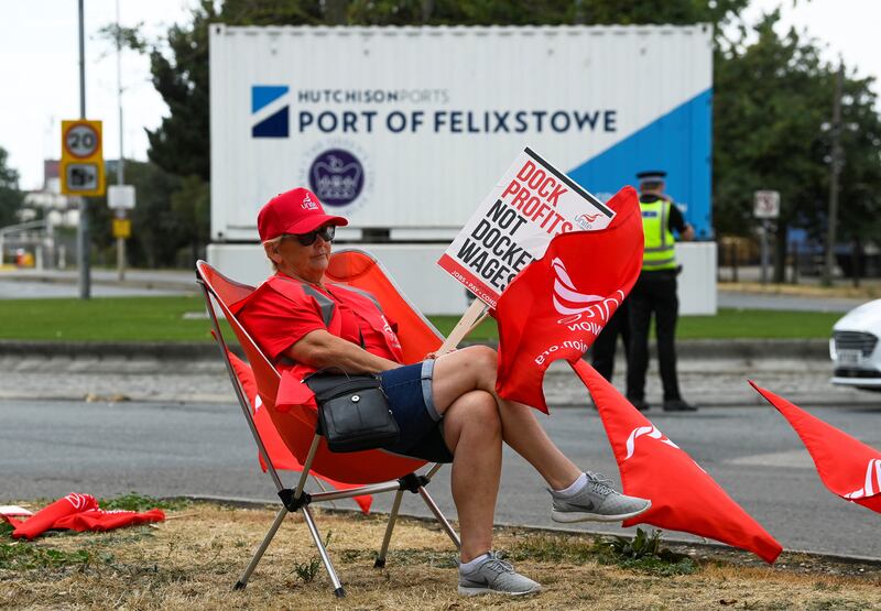 A worker protests outside the entrance to the port at Felixstowe. Reuters