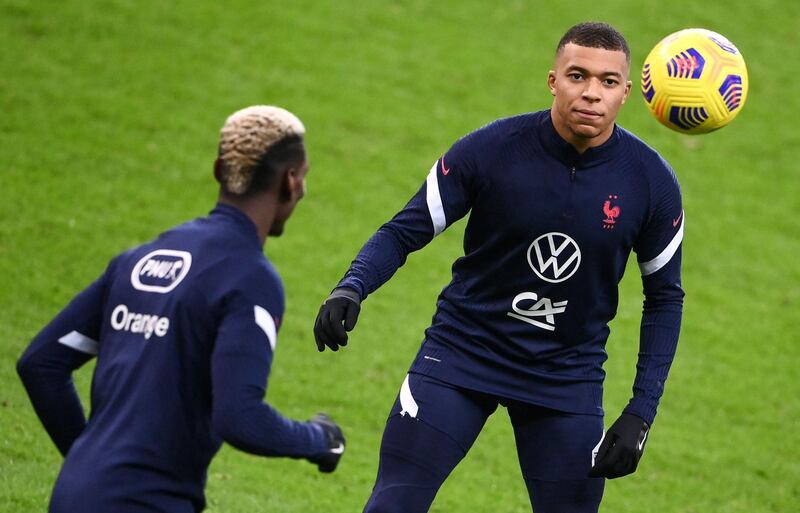 Kylian Mbappe and Paul Pogba take part in a training session at the Stade de France ahead of the Uefa Nations League match between France and Sweden. AFP