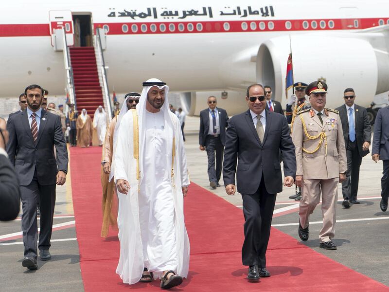 CAIRO, EGYPT - August 07, 2018: HH Sheikh Mohamed bin Zayed Al Nahyan Crown Prince of Abu Dhabi and Deputy Supreme Commander of the UAE Armed Forces (centre L), is received by HE Abdel Fattah El Sisi, President of Egypt (centre R), upon arrival at Cairo international Airport, commencing an official visit.

( Rashed Al Mansoori / Crown Prince Court - Abu Dhabi )
---