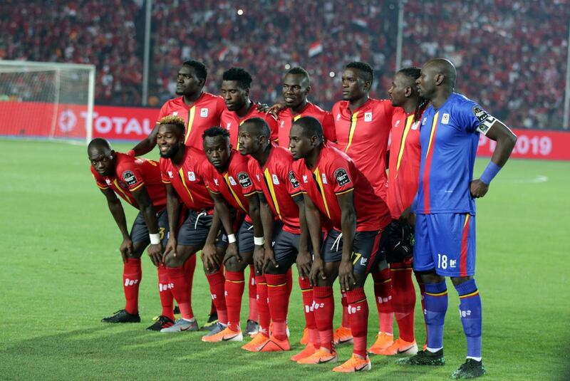 Uganda players pose before the match. EPA