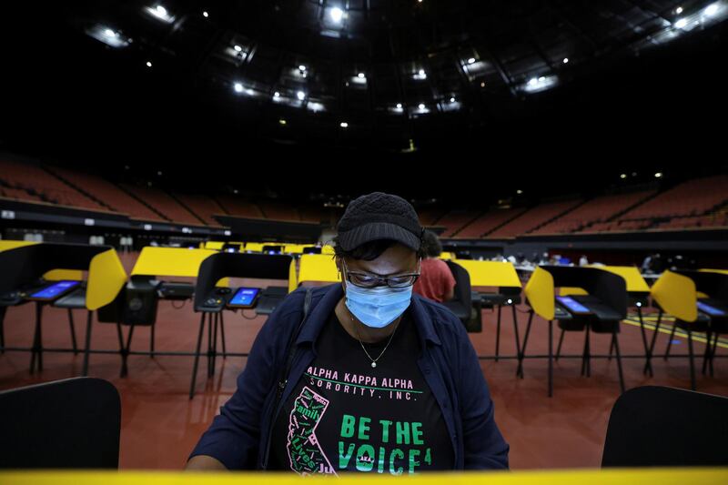 Vanessa Hirsi, 58, votes in the US presidential election at the Forum on the first day of California in-person voting, amid the global outbreak of the coronavirus disease, in Los Angeles, California, US. Reuters