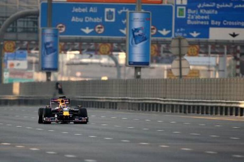 DUBAI, UNITED ARAB EMIRATES Ð Nov 5: Neel Jani driving the F1 car for shooting the Red Bull advertisement on Sheikh Zayed Road in Dubai.  (Pawan Singh / The National) For News. Story by Eugene