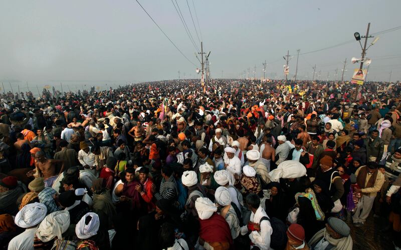 Thousands of Hindu devotees gather at Sangam, the confluence of the Ganges, Yamuna and mythical Saraswati river on Makar Sankranti,  the first day of the Maha Kumbh Mela, in Allahabad, early Monday morning, Jan. 14, 2013. Millions of Hindu pilgrims are expected to take part in the large religious congregation, which falls every 12 years and lasts for a period of over a month, during which devotees wash themselves in the waters of the Ganges believing that it washes away their sins and ends the process of reincarnation. (AP Photo /Manish Swarup) *** Local Caption ***  India Maha Kumbh.JPEG-0a7a8.jpg
