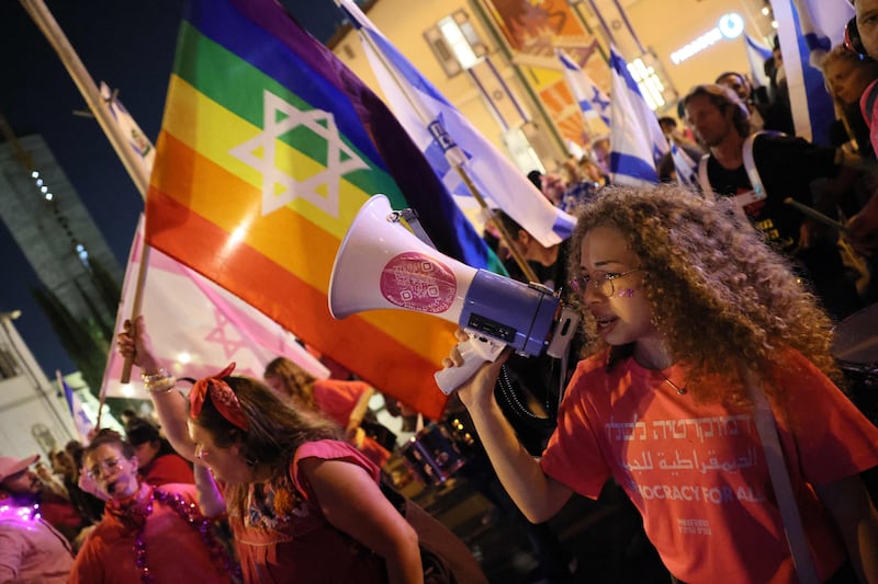 Demonstrators chant during a rally in Tel Aviv to protest the Israeli government's judicial overhaul bill, as the country begins celebrations for its 75th anniversary, on April 25, 2023. AFP