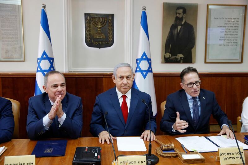 Israeli Prime Minister Benjamin Netanyahu, center, Government Secretary Tzahi Braverman, center right, Yuval Steinitz Israel's Minister of Energy, center left, in charge of Israel Atomic Energy Commission attend the weekly cabinet meeting at the prime minister's office in Jerusalem, Sunday, Nov. 18, 2018. (Abir Sultan/Pool via AP)