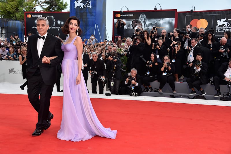 VENICE, ITALY - SEPTEMBER 02:  George Clooney and Amal Clooney walk the red carpet ahead of the 'Suburbicon' screening during the 74th Venice Film Festival at Sala Grande on September 2, 2017 in Venice, Italy.  (Photo by Pascal Le Segretain/Getty Images)