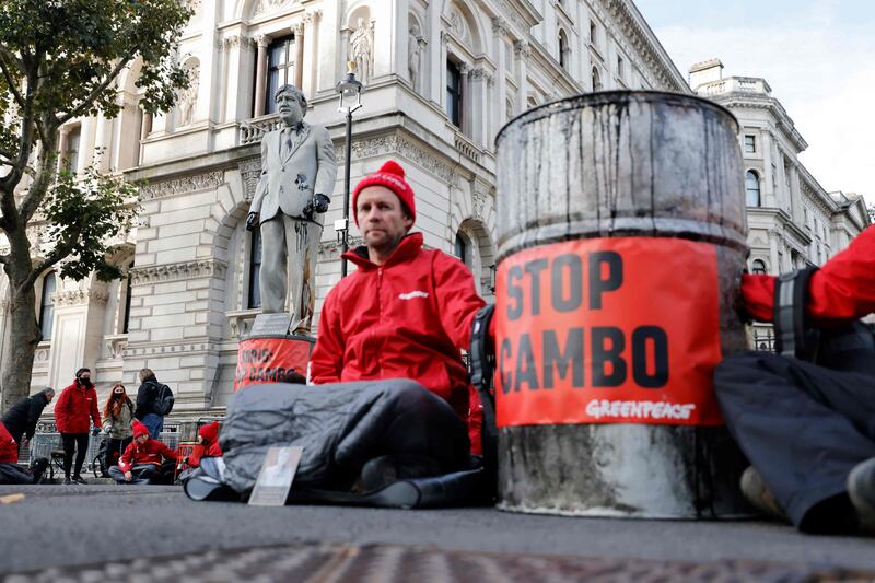 Greenpeace activists stage a sit-in at Downing Street in London, protesting against the Cambo oil field project in the Shetland Islands. AFP