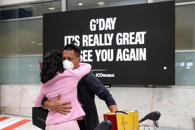 People embrace at Sydney's international airport. Bloomberg

