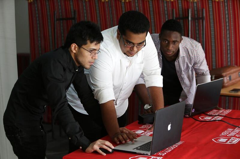 Rohit Jaggi, Shuji Shafiq and Hassan Belo – students at the University of Wollongong work on their project. Pawan Singh / The National
