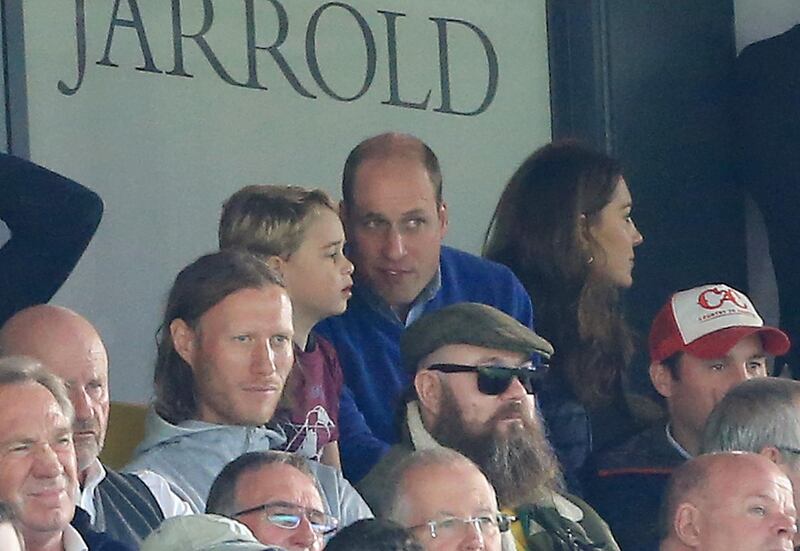 Prince George speaks to Prince William, Duke of Cambridge, during the Premier League match between Norwich City and Aston Villa at Carrow Road. Getty Images