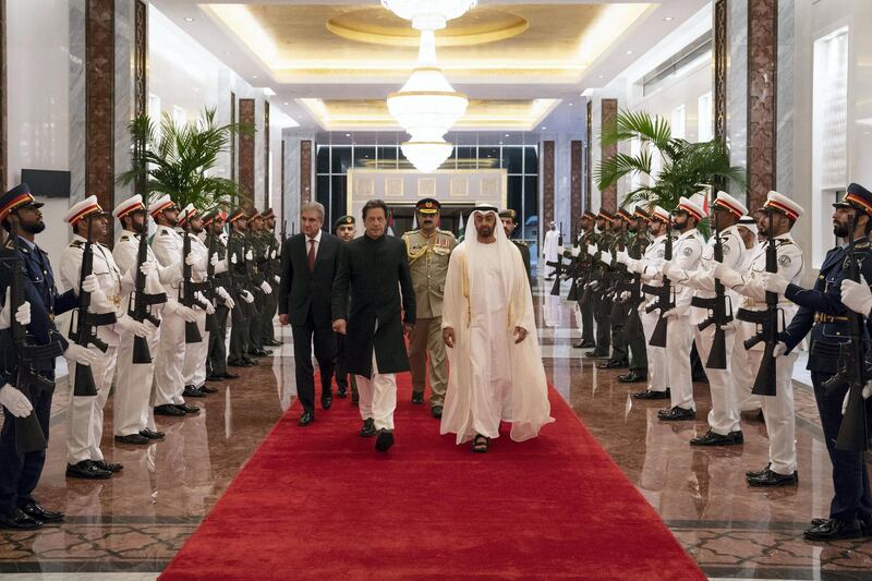 ABU DHABI, UNITED ARAB EMIRATES - September 19, 2018: HH Sheikh Mohamed bin Zayed Al Nahyan Crown Prince of Abu Dhabi Deputy Supreme Commander of the UAE Armed Forces (center R), receives HE Imran Khan Prime Minister of Pakistan (center L), during a reception at the Presidential Airport. 

( Hamad Al Kaabi / Crown Prince Court - Abu Dhabi )
---