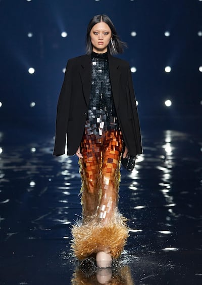 A blazer teamed with a sequined gown at the autumn / winter 2021 show for Givenchy. Courtesy Givenchy