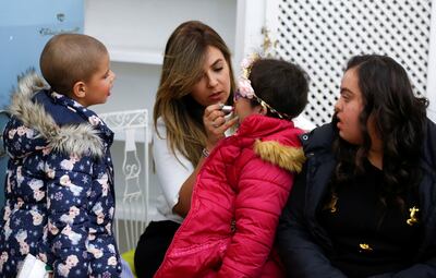 A young cancer patient has make-up applied before a fashion show aiming to battle misconceptions about beauty standards and empower women and girls, in Sidi Bou Said, near Tunis, Tunisia November 27, 2021. Reuters