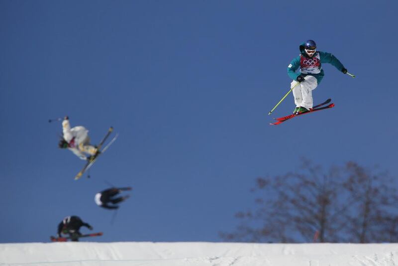 Australia's Russell Henshaw, right, takes a jump during freestyle skiing slopestyle training at the 2014 Winter Olympics in Krasnaya Polyana on Monday. Sergei Grits / AP