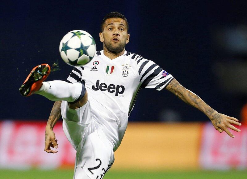 Juventus’ Dani Alves kicks the ball during the Champions League Group H match against Dinamo Zagreb. Antonio Bronic / Reuters