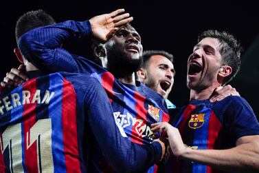 Barcelona's Franck Kessie, centre, celebrates with teammates after scoring his team's second goal during the Spanish La Liga soccer match between Barcelona and Real Madrid at Camp Nou stadium in Barcelona, Spain, Sunday, March 19, 2023.  (AP Photo / Joan Mateu)