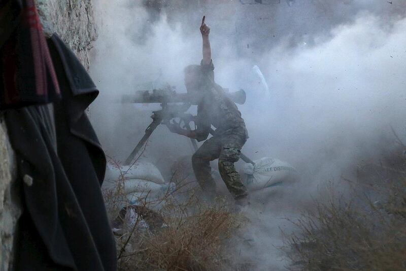 A rebel fighter during clashes with forces loyal to Syria’s president Bashar Al Assad on the frontline of Aleppo’s Sheikh Saeed neighbourhood on May 23, 2015. Regime forces are fighting the Free Syrian Army as well as ISIL in Syria’s civil war. Hosam Katan/Reuters