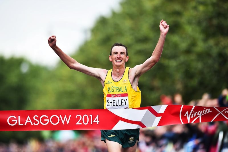 Australia's Michael Shelley celebrates at the finish line as he wins the men's marathon athletics event at the Glasgow City Marathon Course during the 2014 Commonwealth Games in Glasgow, Scotland on July 27, 2014. AFP PHOTO / ANDREJ ISAKOVIC

